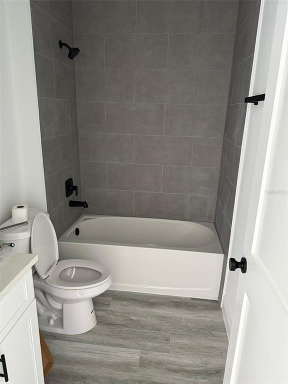 17490 Southwest 27th Circle Ocala, FL 34473 - Photo 8 of 12 a white toilet sitting next to a bath tub
