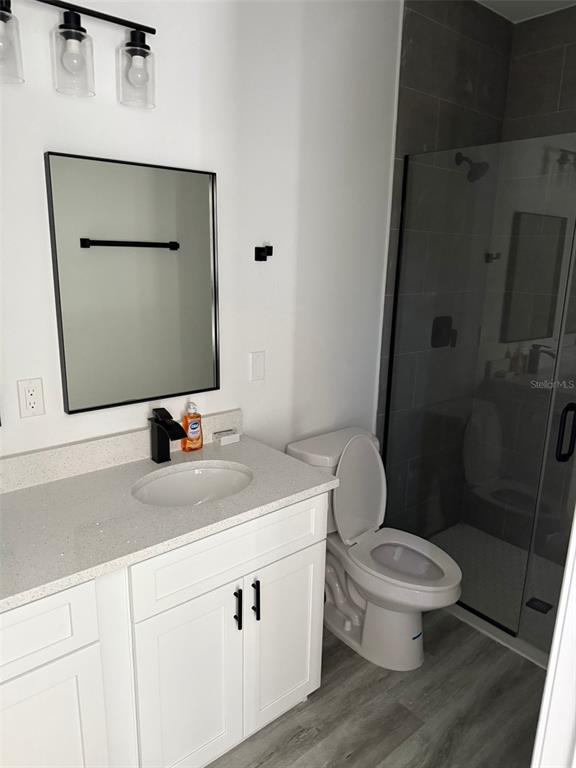 17490 Southwest 27th Circle Ocala, FL 34473 - Photo 10 of 12 a bathroom with a toilet sink and mirror