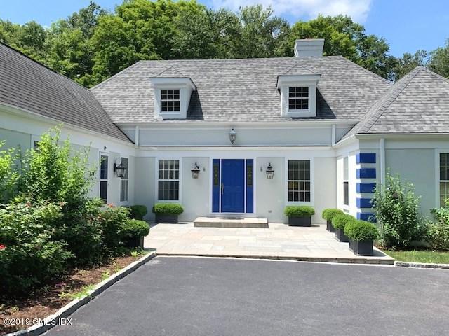 244 Stanwich Road Greenwich, CT 06830 - Photo 22 of 22 a front view of a house with yard and green space