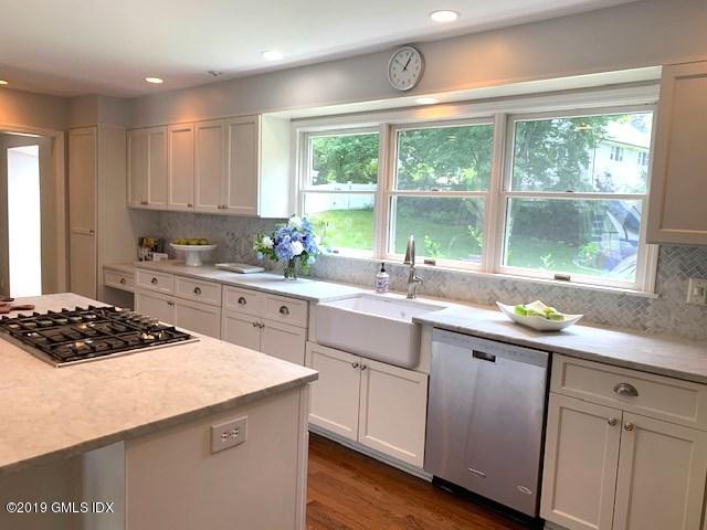 244 Stanwich Road Greenwich, CT 06830 - Photo 5 of 22 a kitchen with a sink stove and cabinets