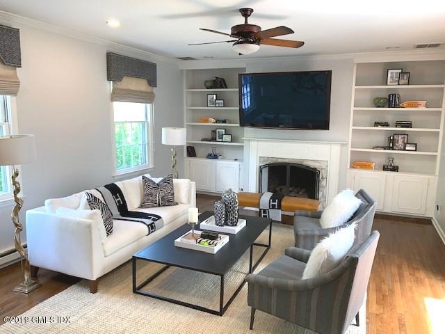 244 Stanwich Road Greenwich, CT 06830 - Photo 8 of 22 a living room with furniture fireplace and a flat screen tv