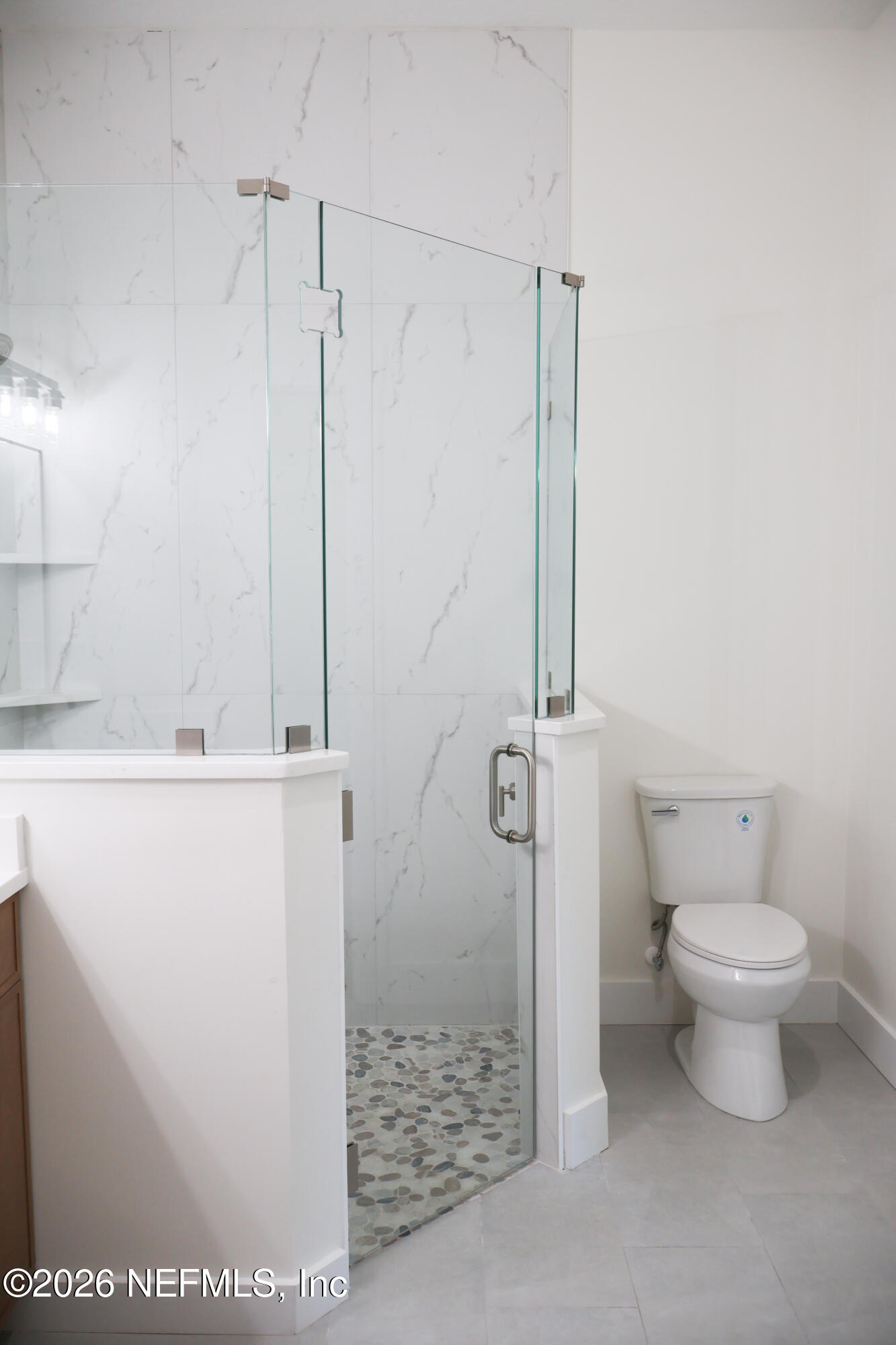 261121 Rowe Road Hilliard, FL 32046 - Photo 10 of 33 a bathroom with a sink a toilet and shower
