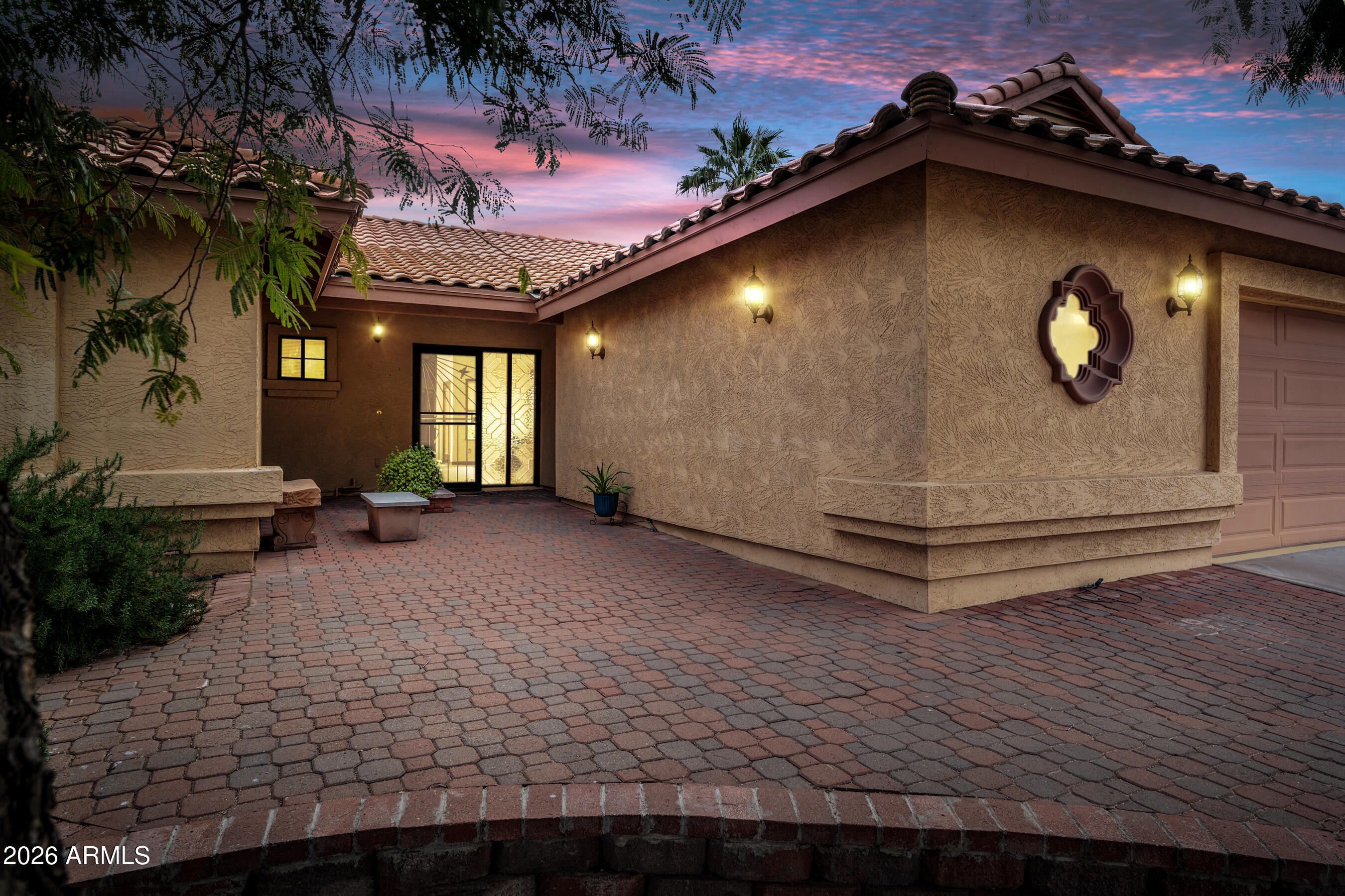 a view of a house with a backyard