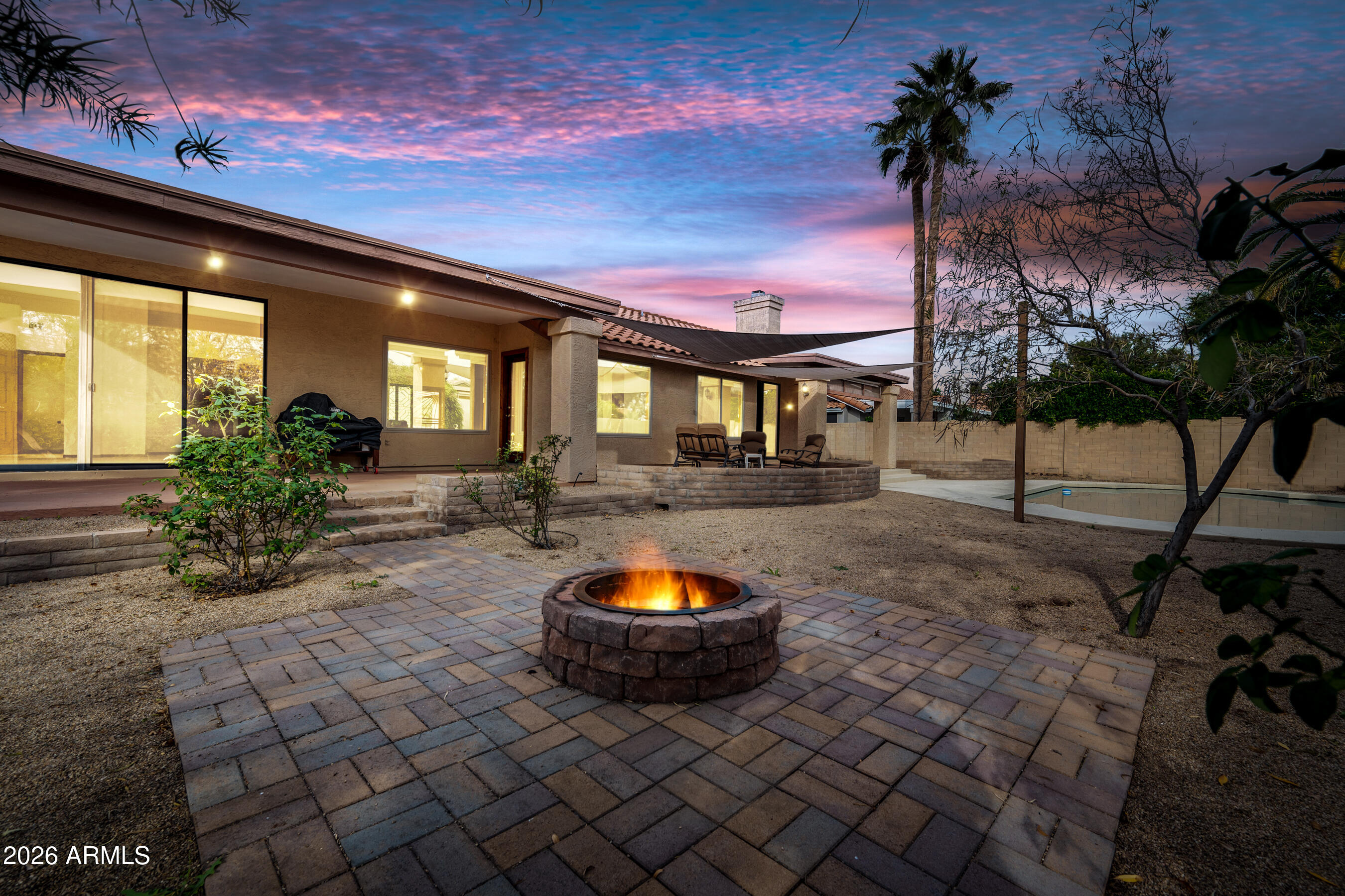 7833 South Terrace Road Tempe, AZ 85284 - Photo 2 of 39 a backyard of a house with table and chairs