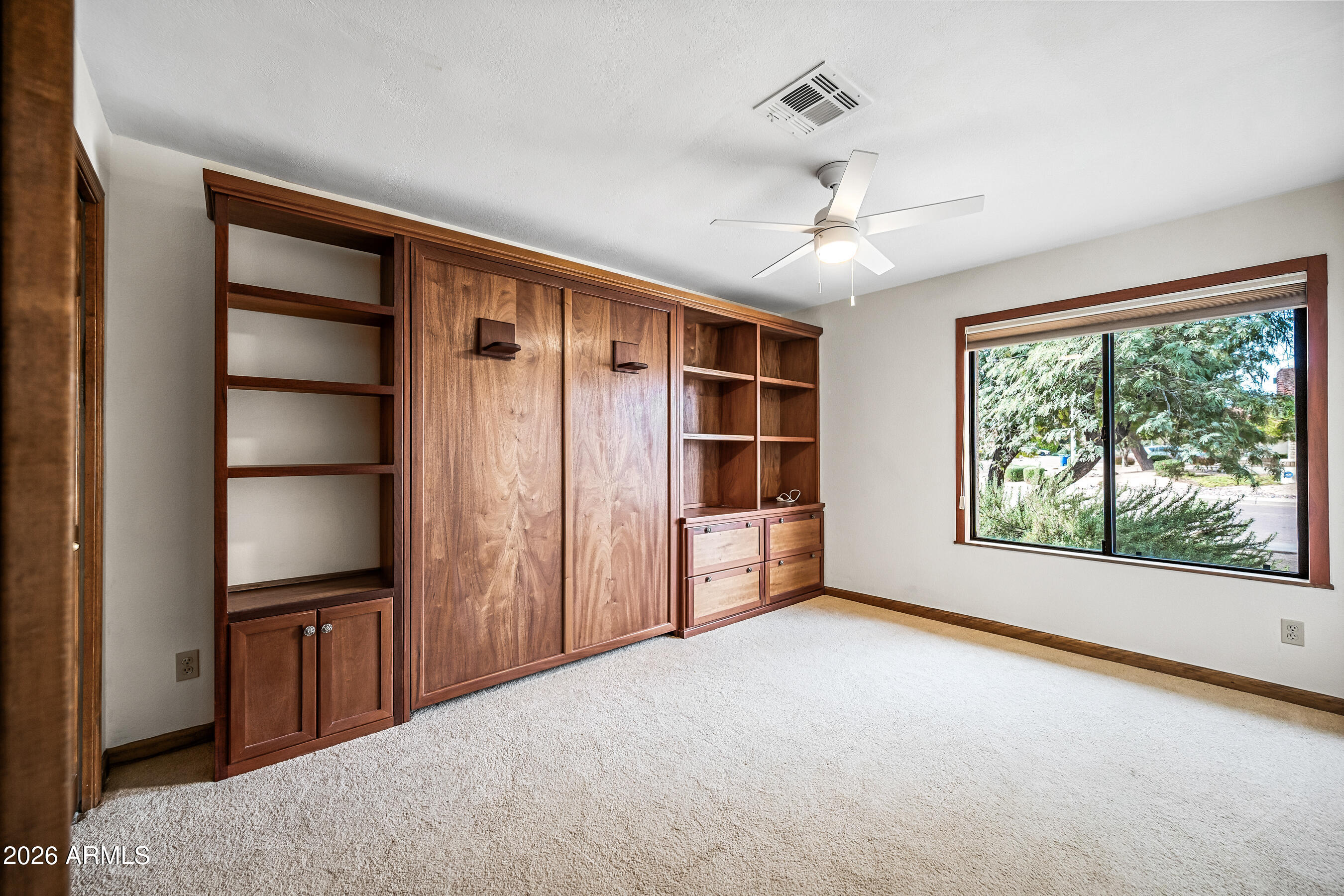 7833 South Terrace Road Tempe, AZ 85284 - Photo 25 of 39 a view of an empty room with a window and cabinet