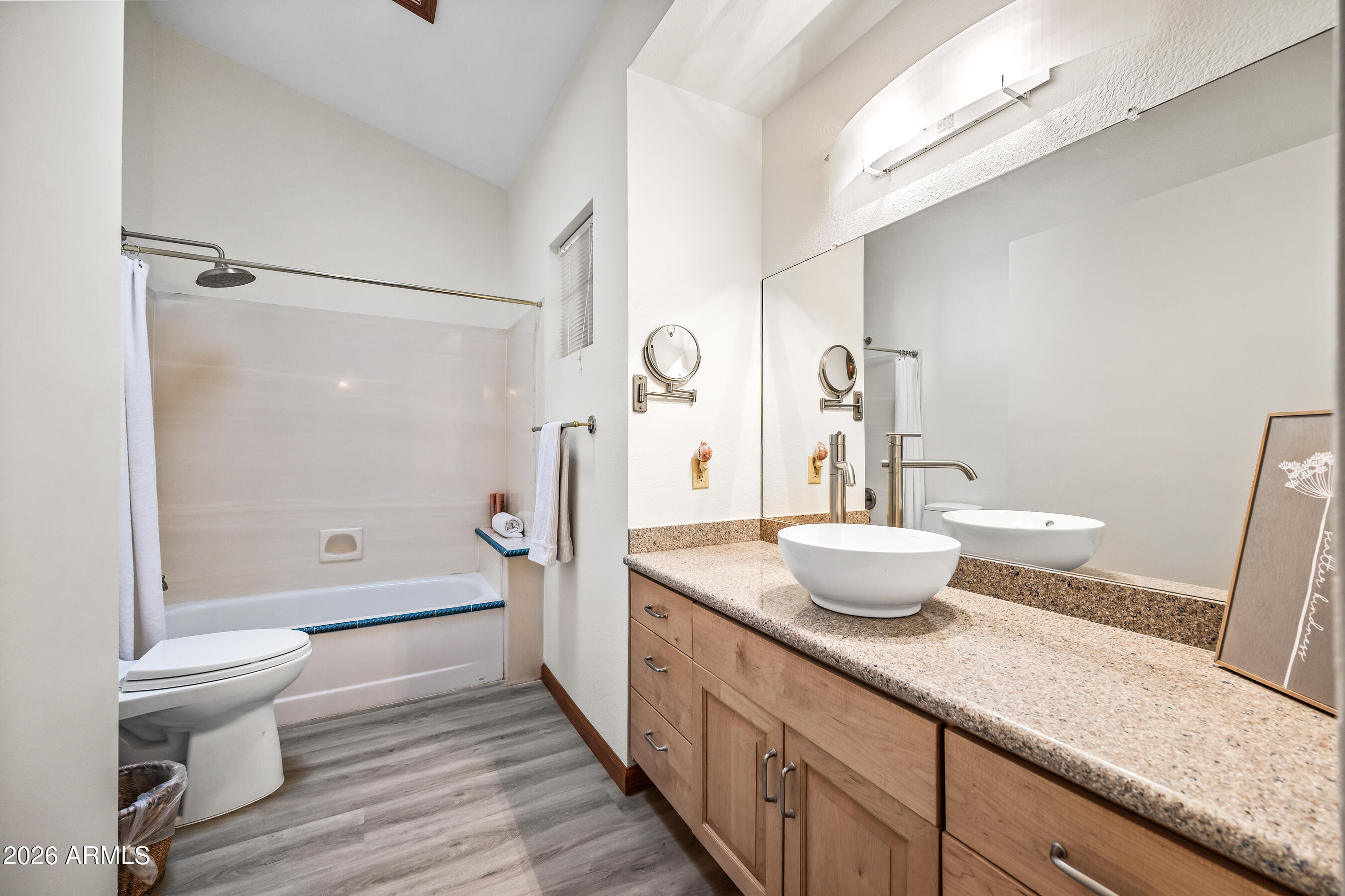 7833 South Terrace Road Tempe, AZ 85284 - Photo 27 of 39 a bathroom with a granite countertop sink a toilet and shower