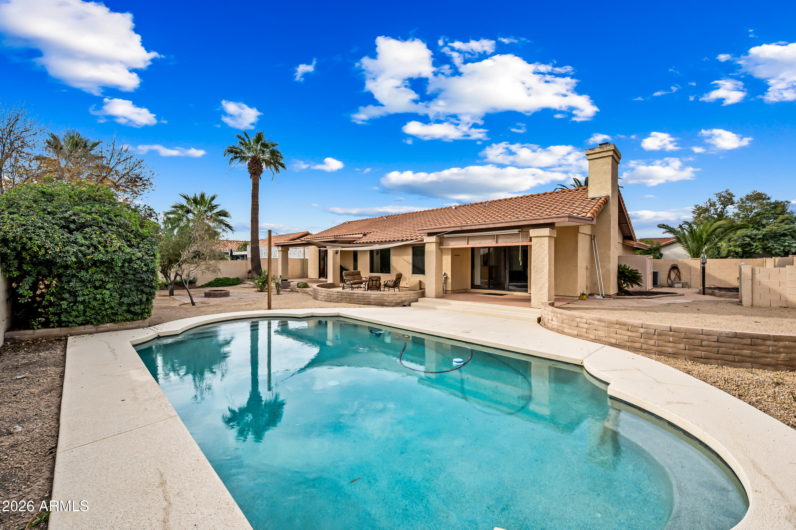 7833 South Terrace Road Tempe, AZ 85284 - Photo 32 of 39 a front view of a house with swimming pool having outdoor seating