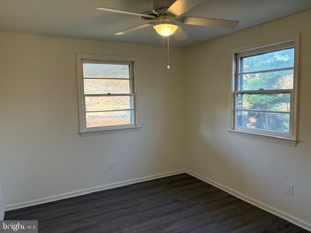 12020 Middlebrook Road Germantown, MD 20874 - Photo 11 of 34 a view of an empty room with wooden floor and a window