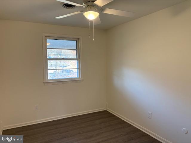 12020 Middlebrook Road Germantown, MD 20874 - Photo 16 of 34 an empty room with wooden floor and windows