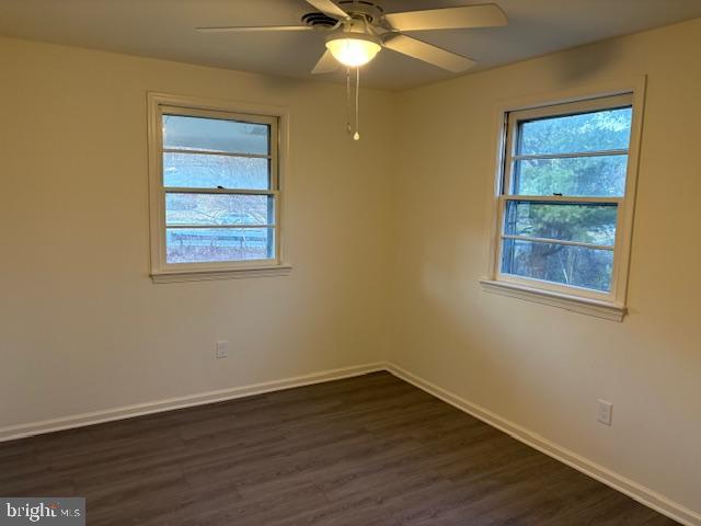 12020 Middlebrook Road Germantown, MD 20874 - Photo 17 of 34 an empty room with wooden floor and windows