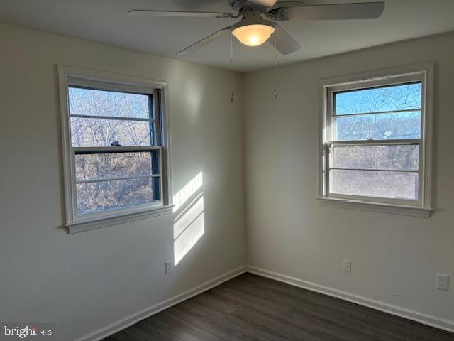 12020 Middlebrook Road Germantown, MD 20874 - Photo 18 of 34 an empty room with wooden floor and windows