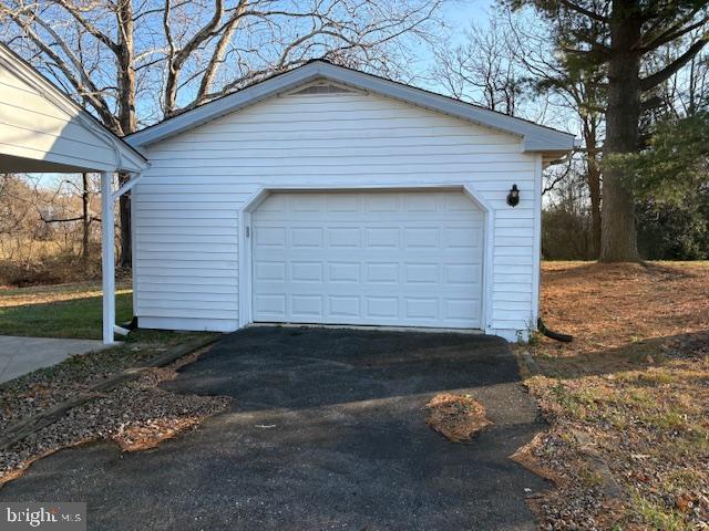 12020 Middlebrook Road Germantown, MD 20874 - Photo 28 of 34 a front view of a house with a yard