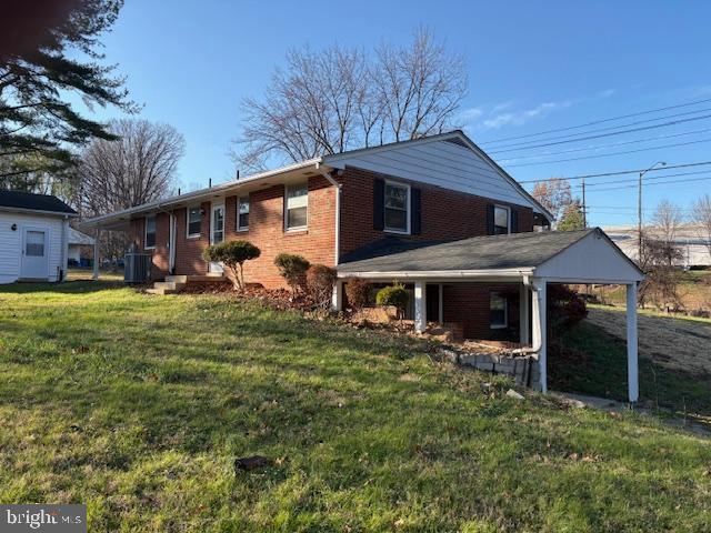 12020 Middlebrook Road Germantown, MD 20874 - Photo 5 of 34 a front view of a house with garden