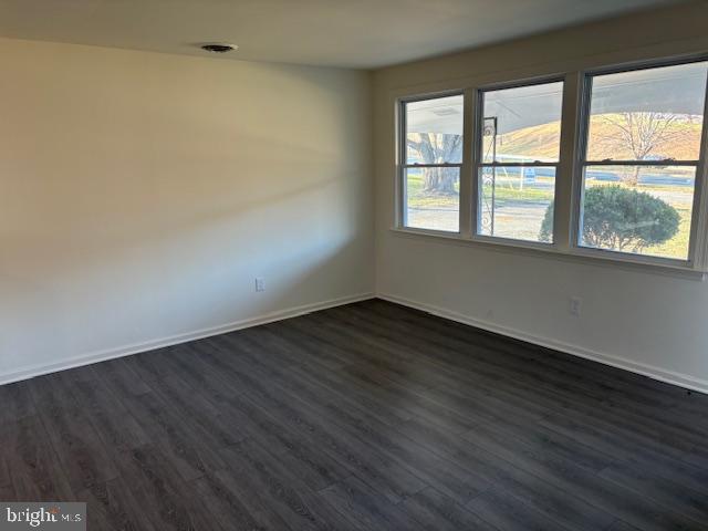 12020 Middlebrook Road Germantown, MD 20874 - Photo 9 of 34 a view of an empty room with wooden floor and a window
