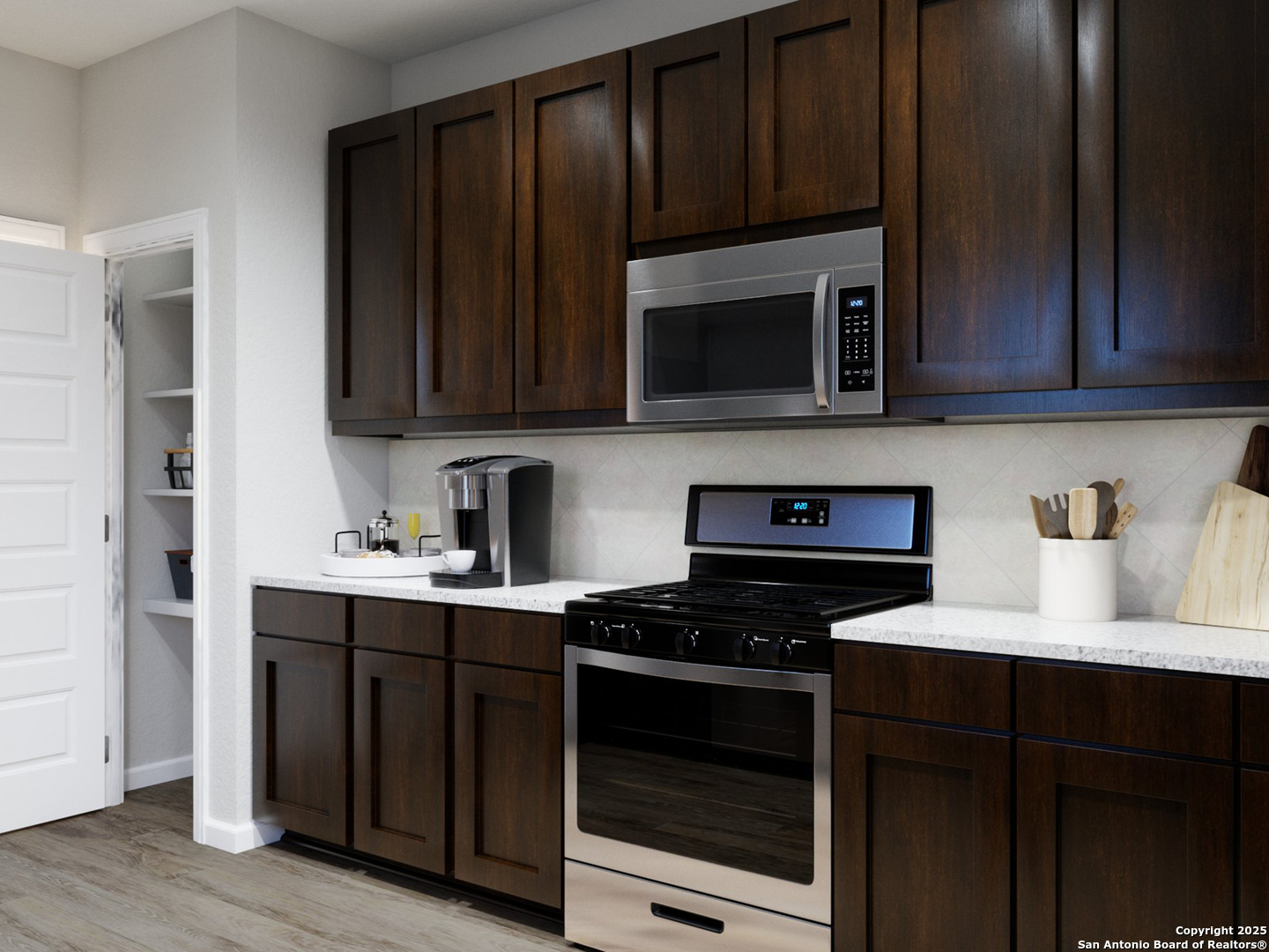 11107 Luckenbach Loop Converse, TX 78109 - Photo 8 of 25 a kitchen with granite countertop wood cabinets and stainless steel appliances