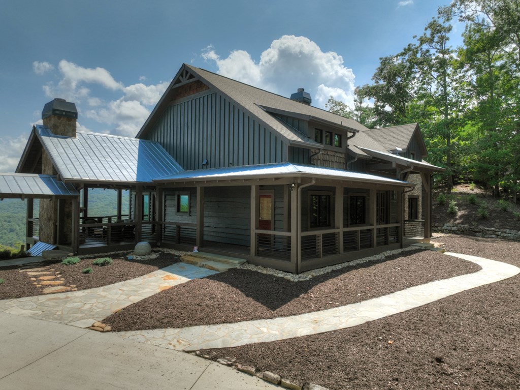 440 Cochise Road Cherry Log, GA 30522 - Photo 63 of 82 a front view of a house with a yard and garage