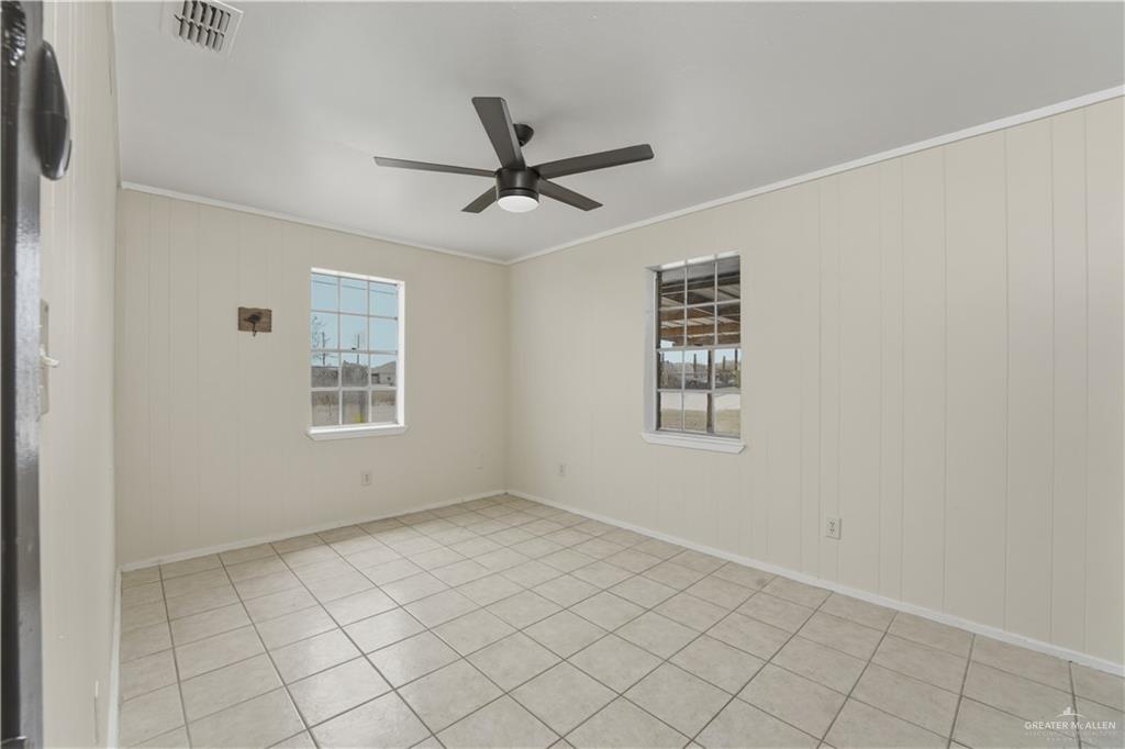 3101 Tom Gill Road Penitas, TX 78576 - Photo 11 of 16 a view of an empty room with a window