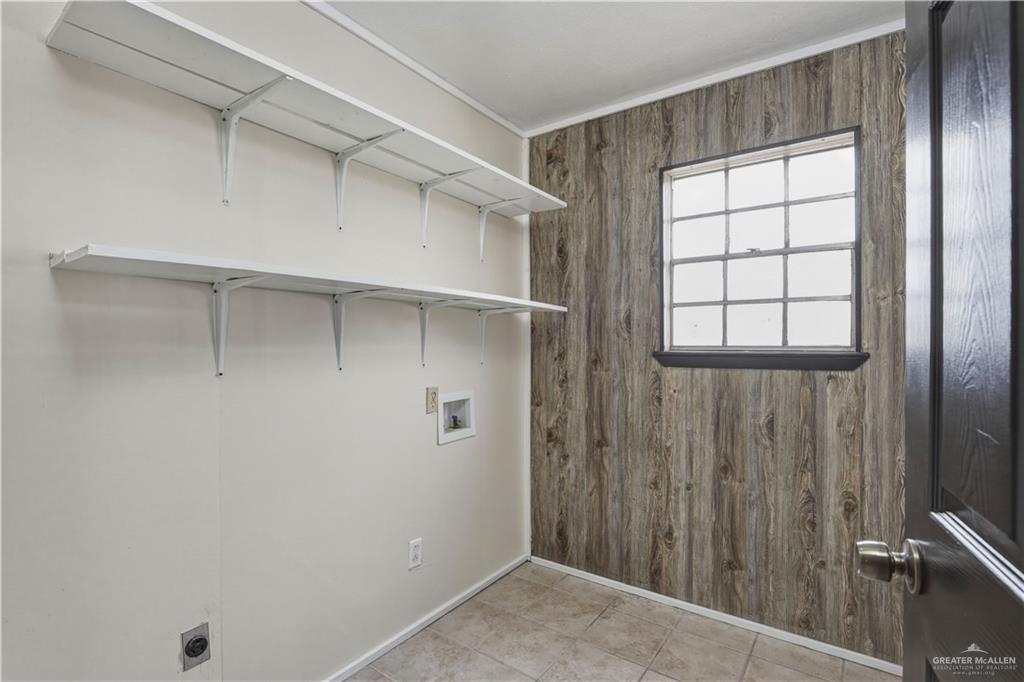 3101 Tom Gill Road Penitas, TX 78576 - Photo 13 of 16 a view of an empty room with a window