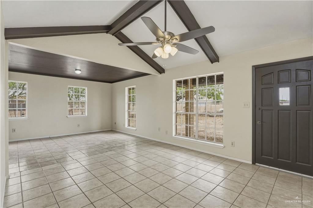 3101 Tom Gill Road Penitas, TX 78576 - Photo 3 of 16 a view of an empty room with a window