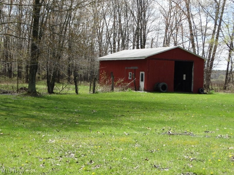 870 Webster Road Jefferson, OH 44047 - Photo 19 of 25 Barn 25X40, cement floors, stalls, loft