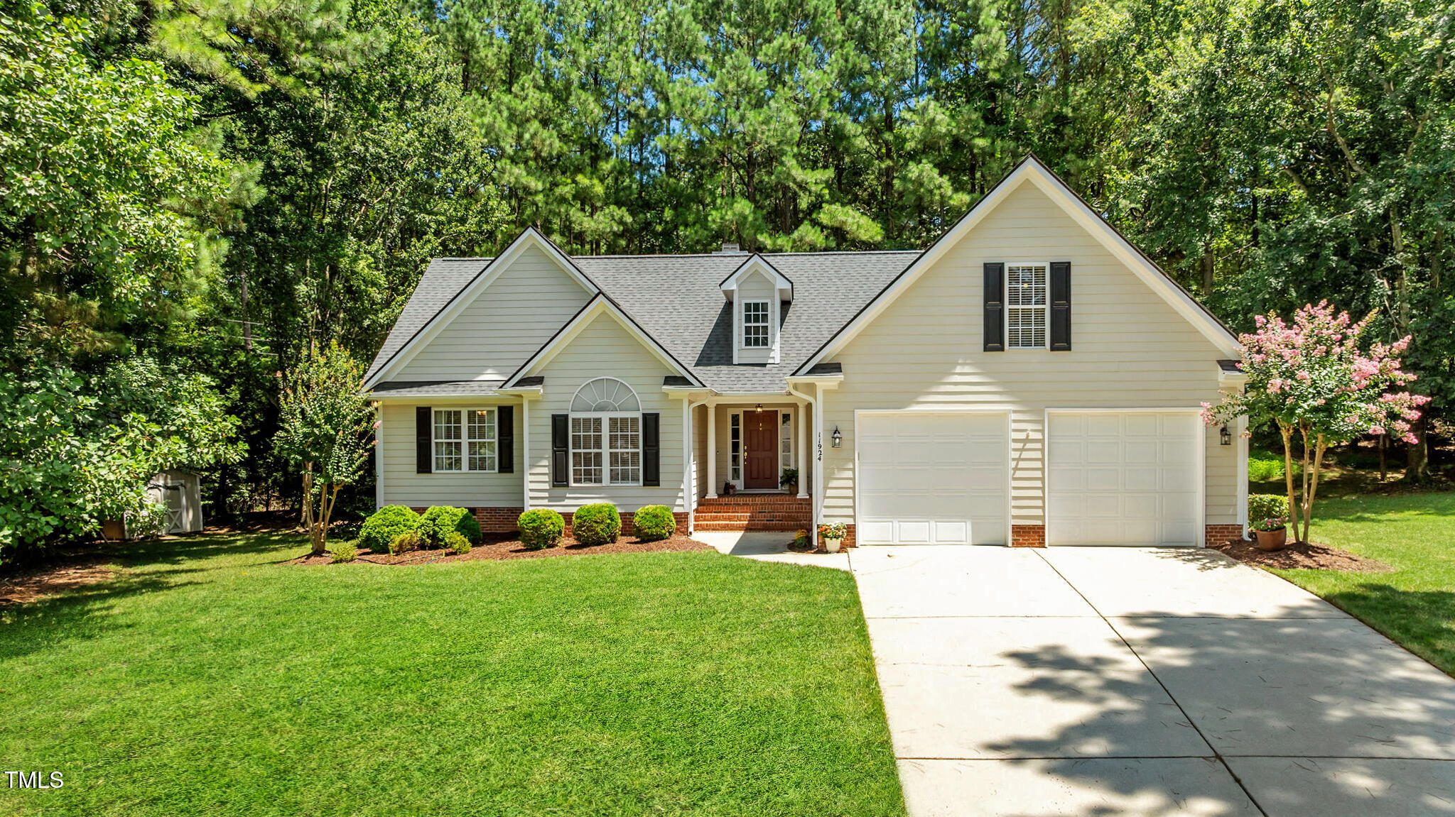 11924 Larka Court Raleigh, NC 27613 - Photo 1 of 44 a front view of house with yard and green space
