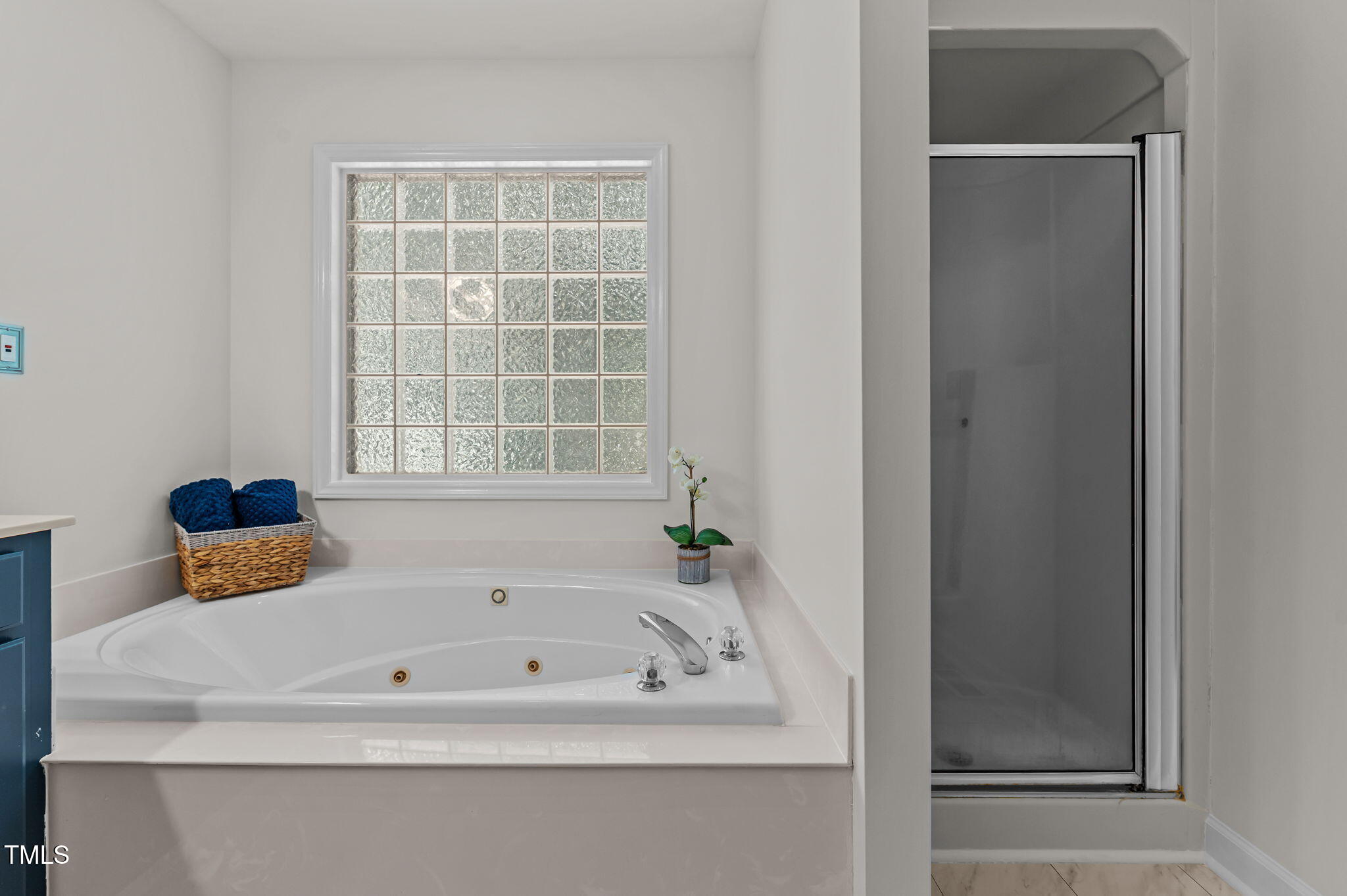 11924 Larka Court Raleigh, NC 27613 - Photo 20 of 44 a bath tub sitting next to a window