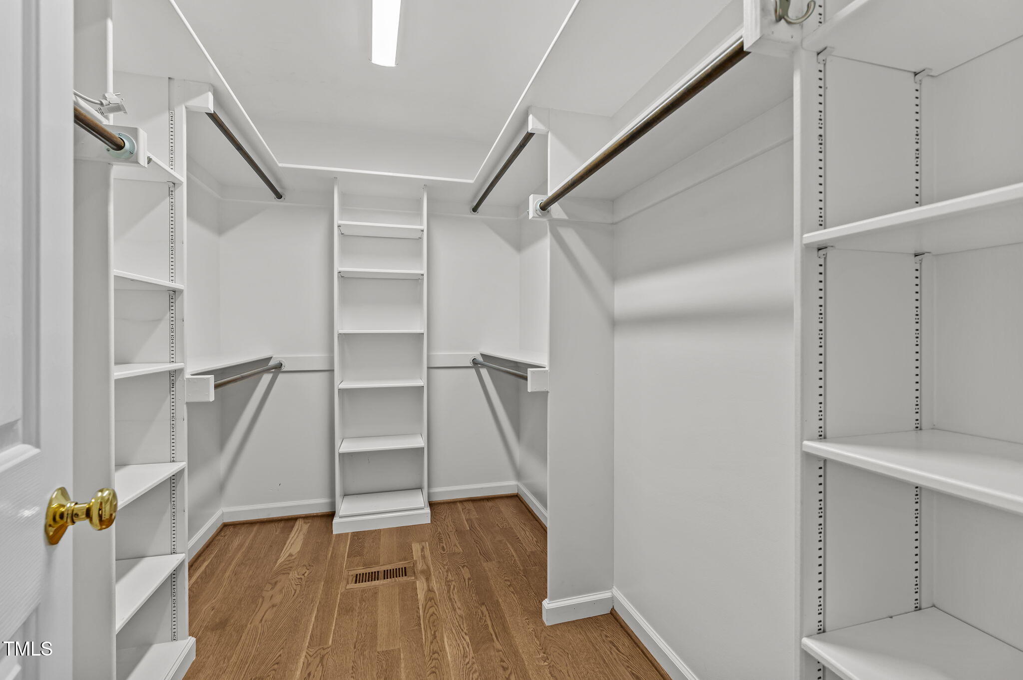 11924 Larka Court Raleigh, NC 27613 - Photo 21 of 44 a view of walk in closet with empty racks