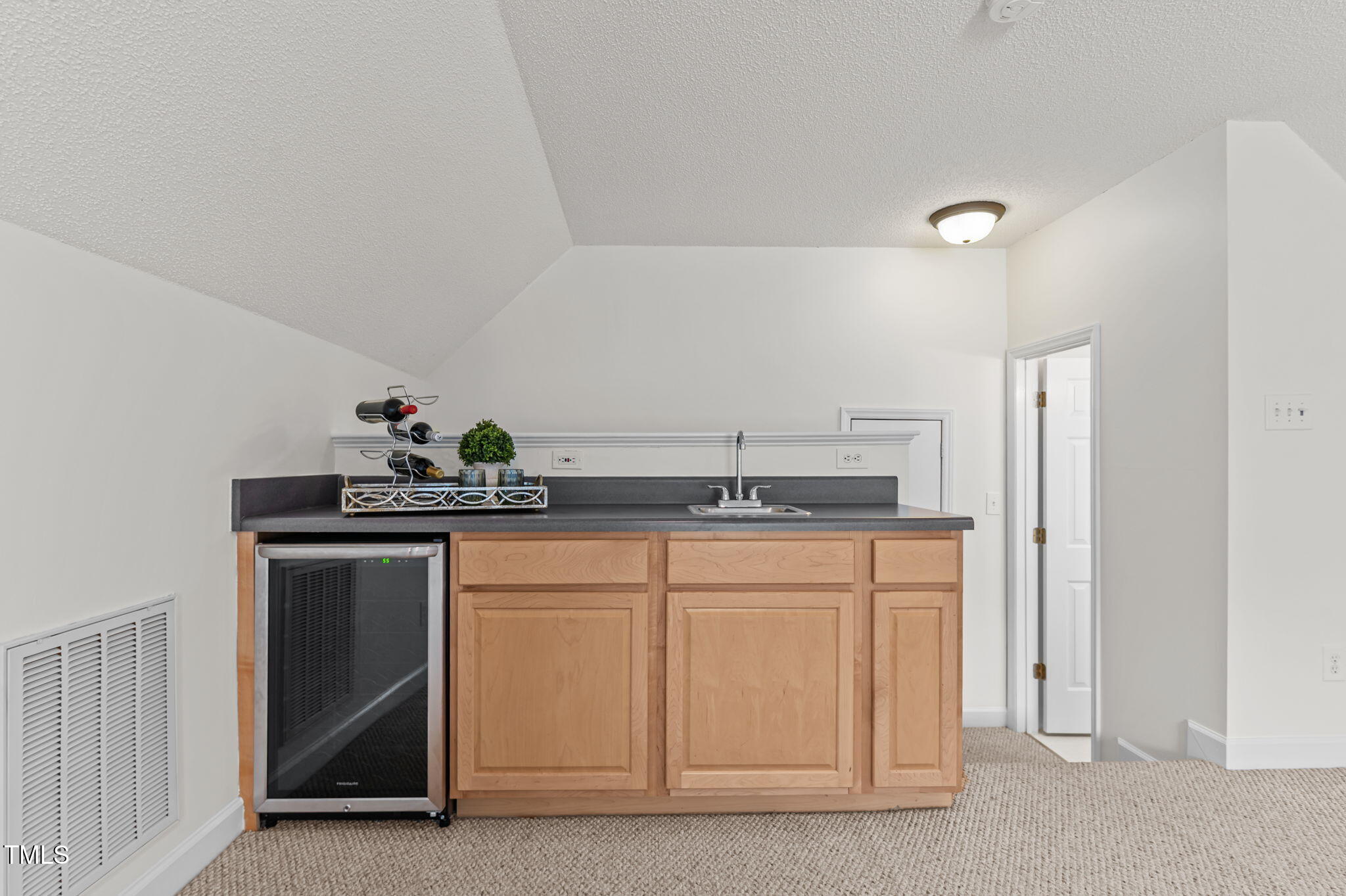 11924 Larka Court Raleigh, NC 27613 - Photo 28 of 44 a kitchen with stainless steel appliances granite countertop a sink and a refrigerator