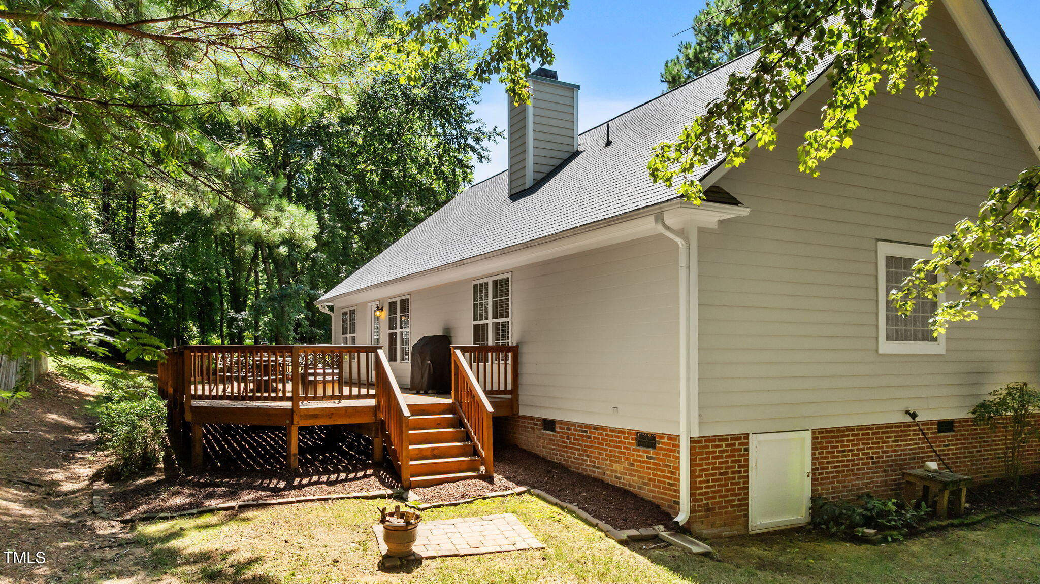 11924 Larka Court Raleigh, NC 27613 - Photo 35 of 44 a view of a patio with a table and chairs