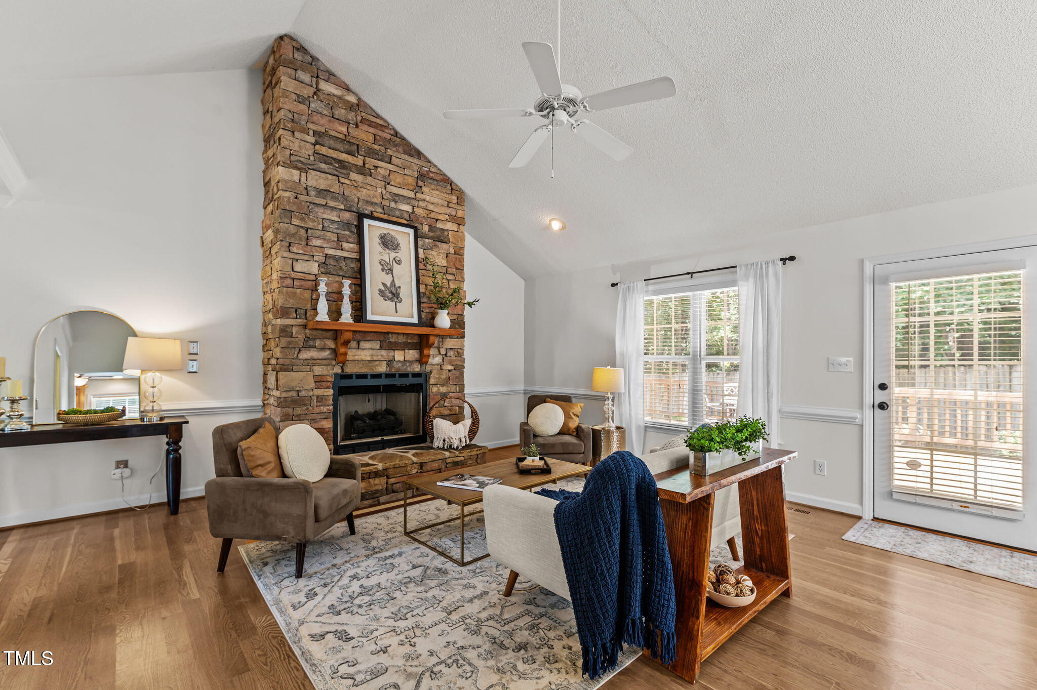 11924 Larka Court Raleigh, NC 27613 - Photo 6 of 44 a living room with furniture and a fireplace