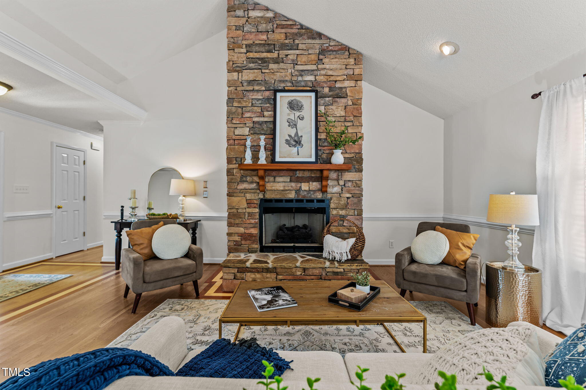 11924 Larka Court Raleigh, NC 27613 - Photo 7 of 44 a living room with furniture and a fireplace
