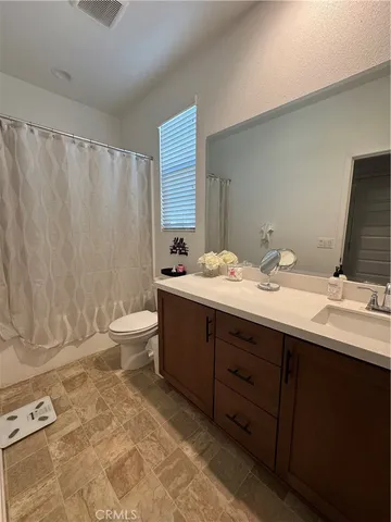 a bathroom with a tub sink and shower