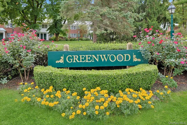 a sign that is sitting in the grass