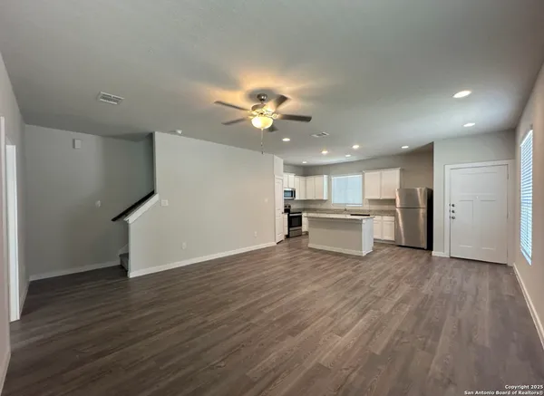 a view of kitchen with wooden floor and window