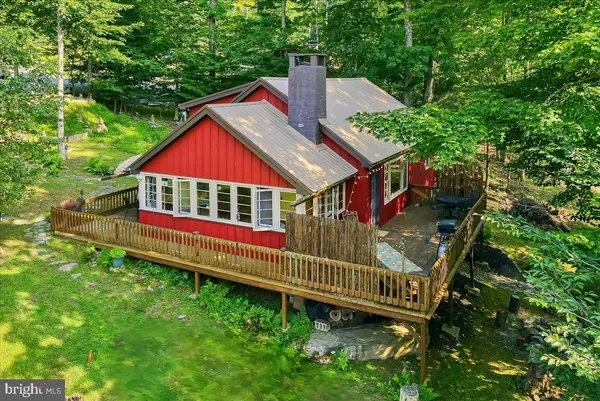 a view of backyard with deck and deck