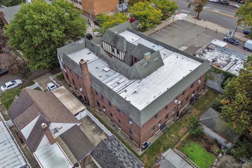 43-24 208th Street Queens, NY 11361 - Photo 3 of 14 an aerial view of a house with a yard