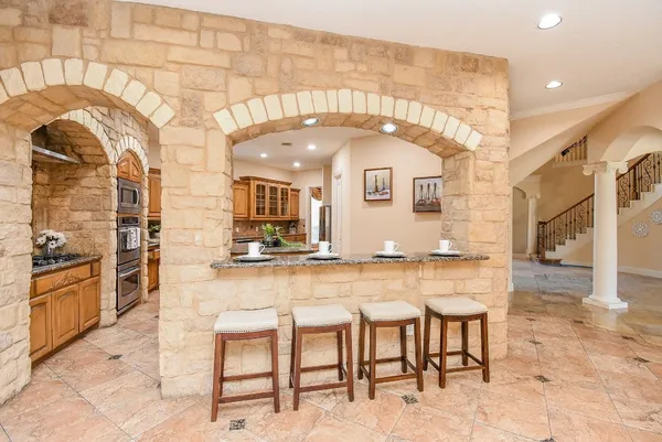 a kitchen with a table and chairs