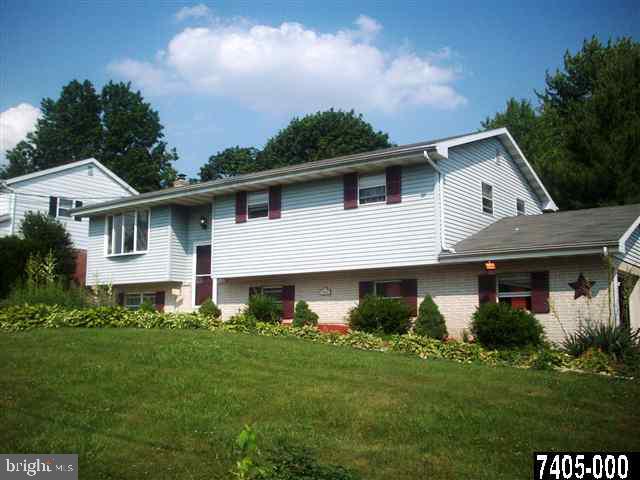 1780 Lilac Road York, PA 17408 - Photo 1 of 21 a front view of a house with a garden