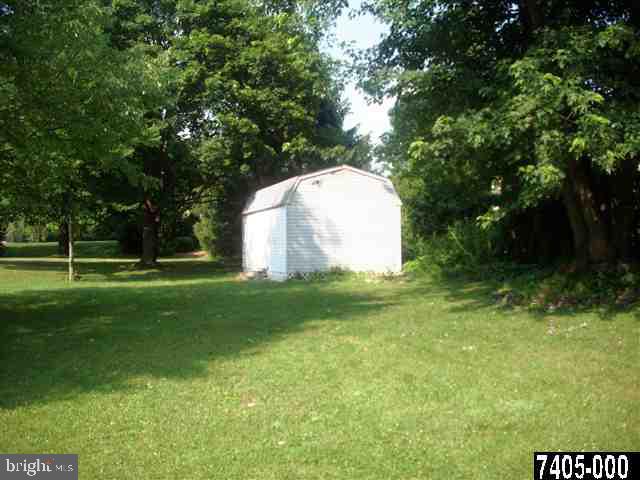 1780 Lilac Road York, PA 17408 - Photo 4 of 21 a view of a white house with a yard