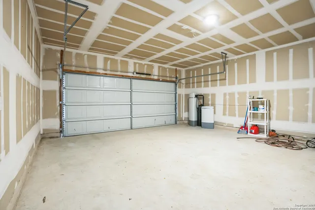 a view of patio with swimming pool and brick wall