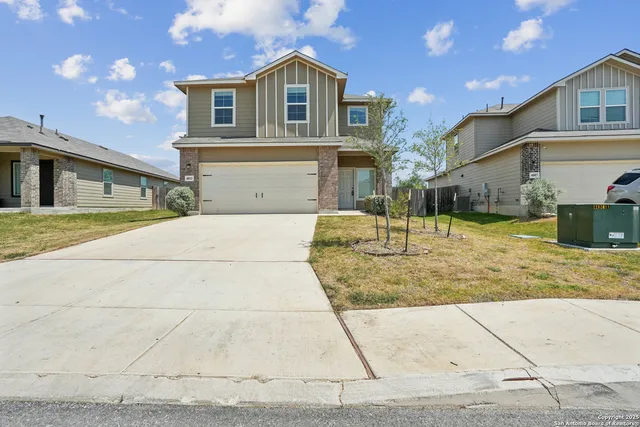 a bathroom with a shower sink and mirror