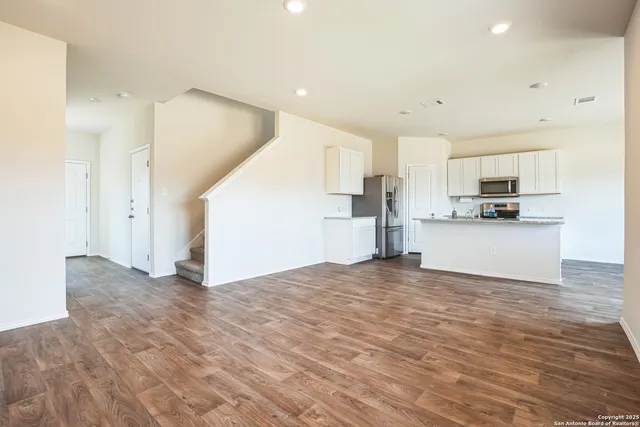 a view of kitchen with wooden floor