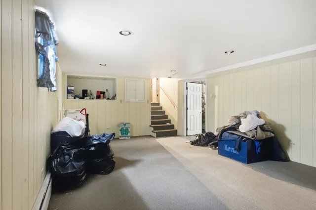 a bed room with furniture and a chandelier
