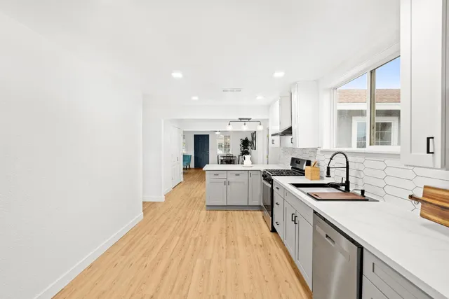 a view of a livingroom with wooden floor