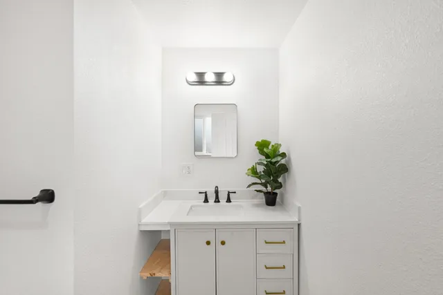 a view of a dining room with furniture and window