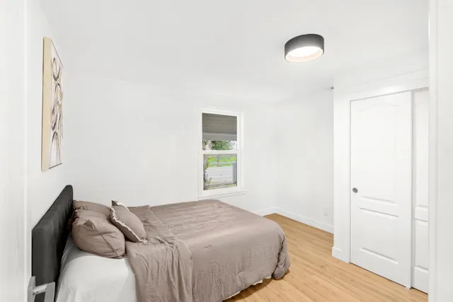 a room with a bed and a window