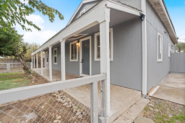 a view of a swimming pool with a yard