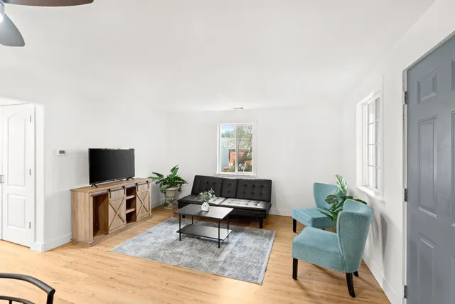 a living room with furniture and a rug