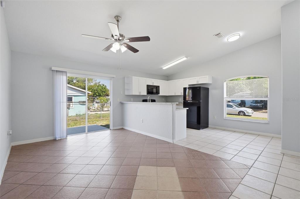 6018 Flora Terrace Apollo Beach, FL 33572 - Photo 11 of 33 a view of a kitchen with furniture and an empty room