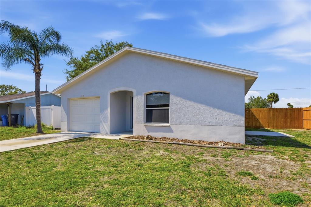 6018 Flora Terrace Apollo Beach, FL 33572 - Photo 2 of 33 a front view of house with yard